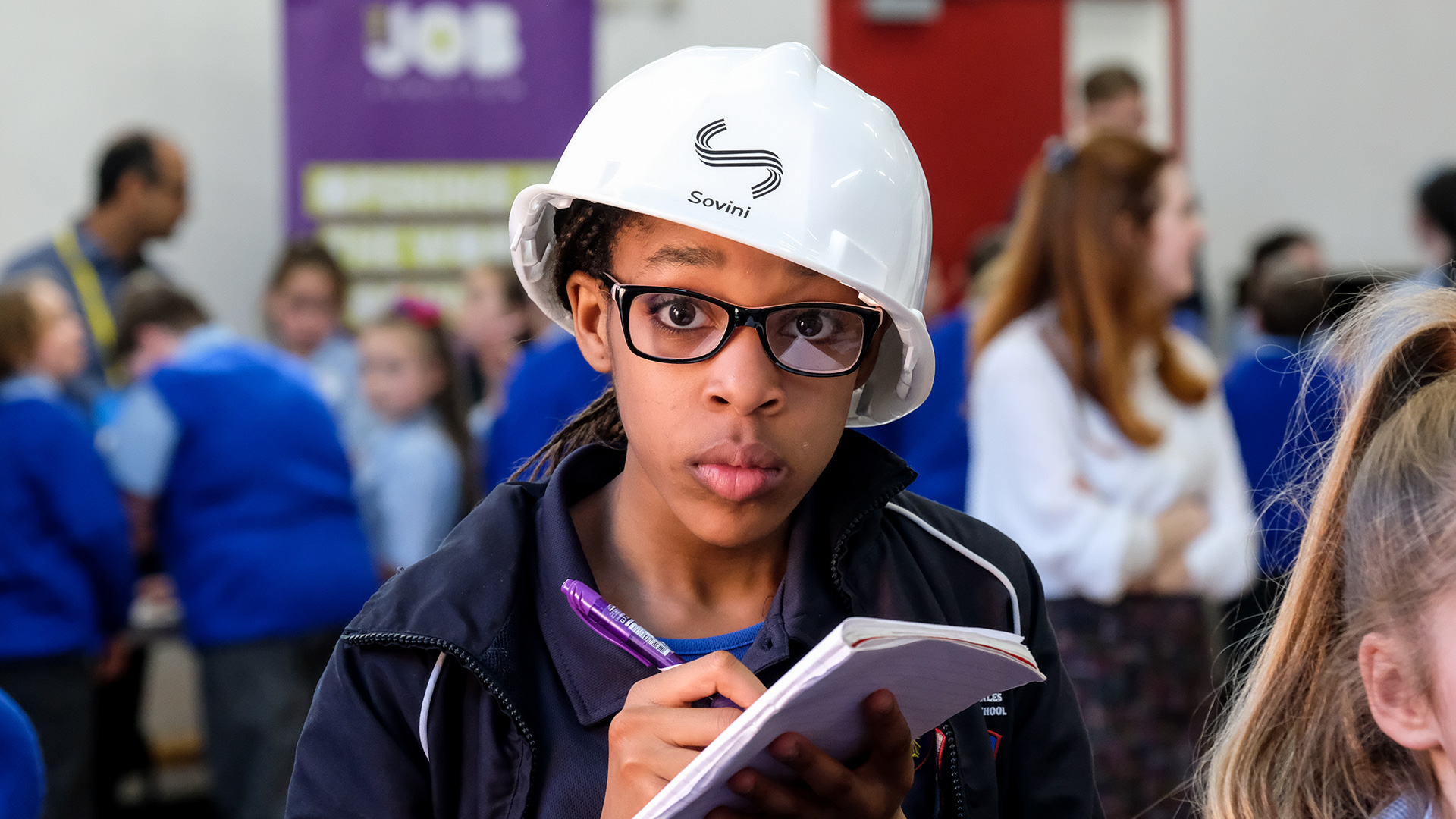 photo of a child holding a notepad