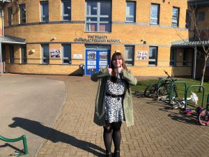 Photo of Positive Footprints apprentice Kate outside her out school