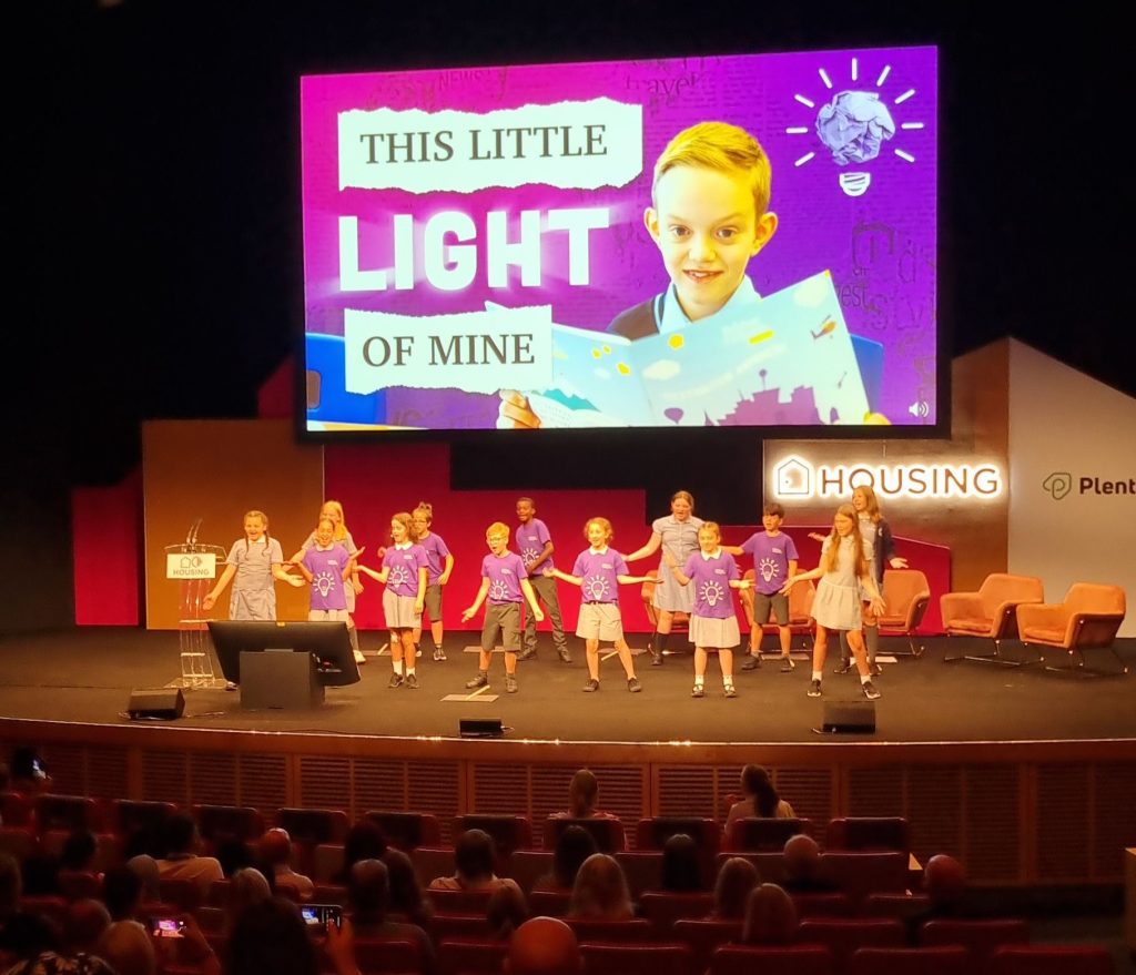 Positive Footprints Network Pupils on stage at Housing 2023 event
