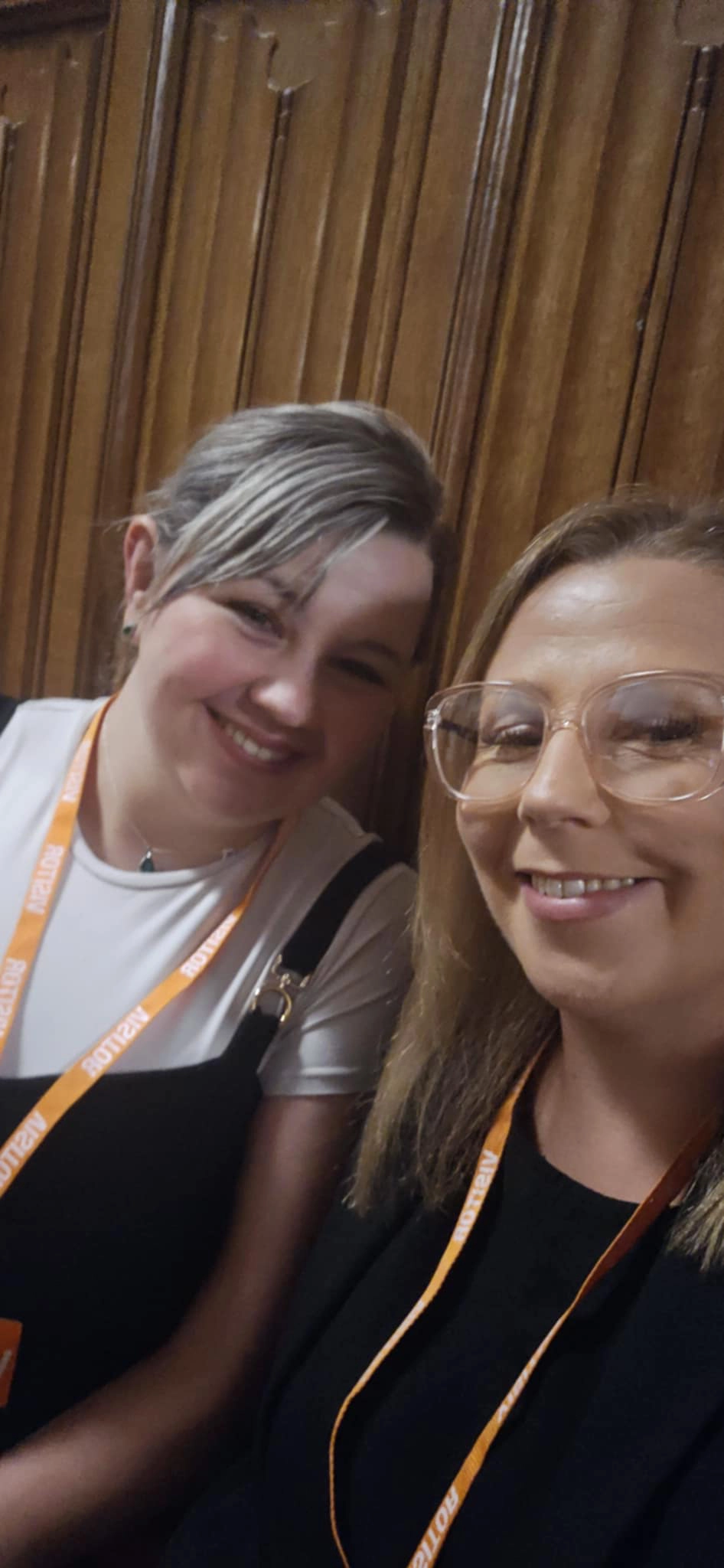 Tegan and her tutor smile at the camera